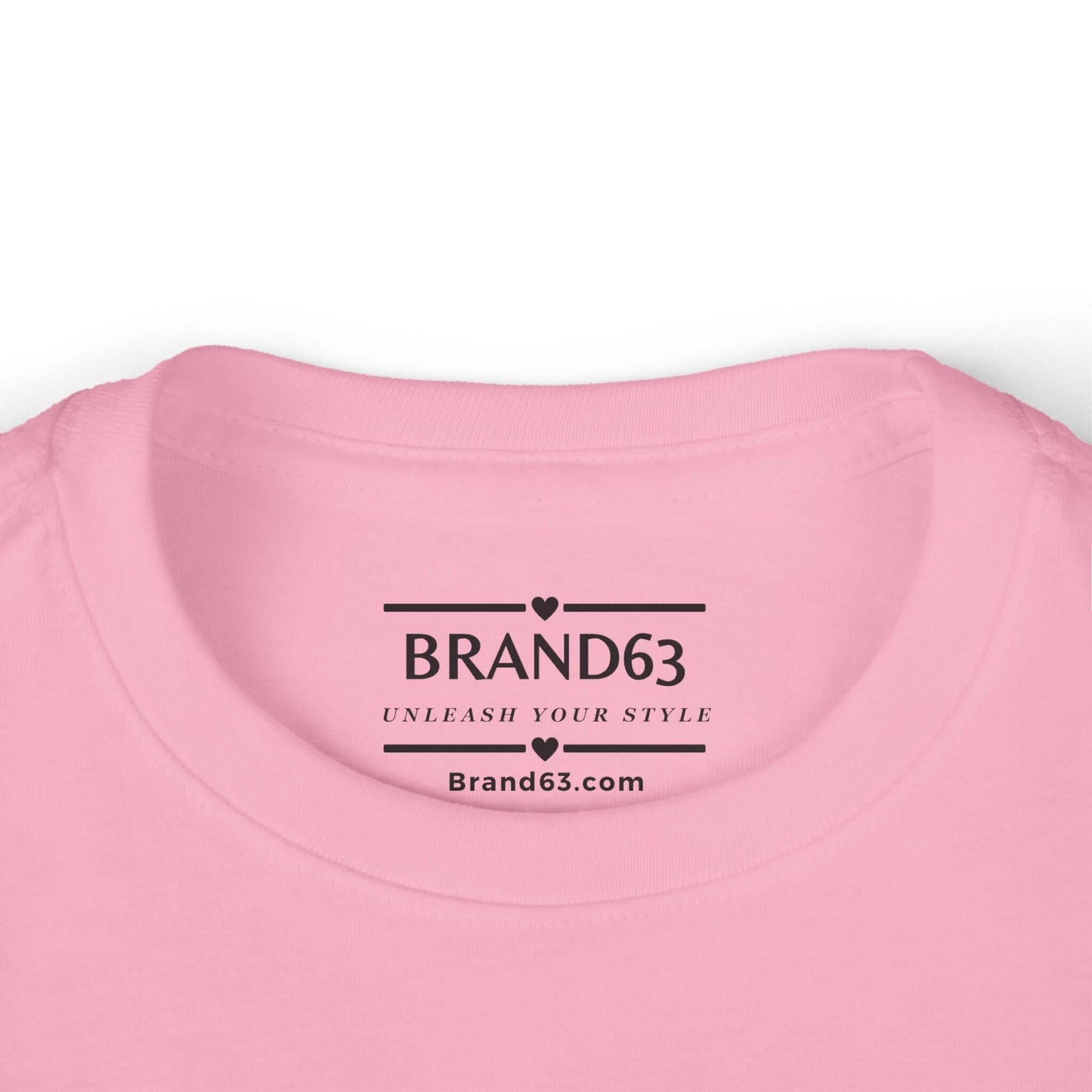 Close-up of the neckline of a pink toddler tee with BRAND63 logo and slogan, soft fabric ideal for little ones.