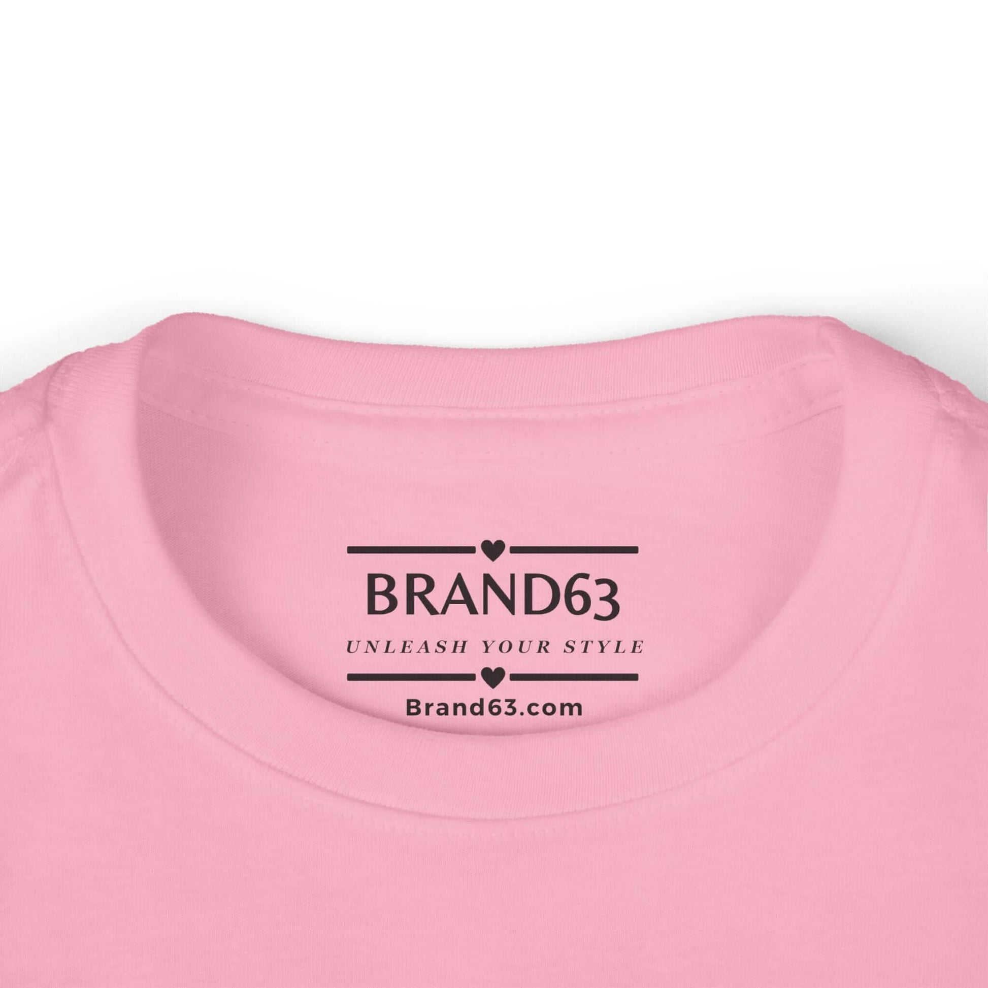 Close-up of the neckline of a pink toddler tee with BRAND63 logo and slogan, soft fabric ideal for little ones.