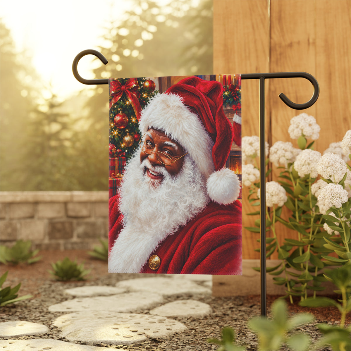 A decorative garden flag featuring a portrait of a smiling Black Santa Claus in a red suit and hat with a white beard. African American Santa Claus
