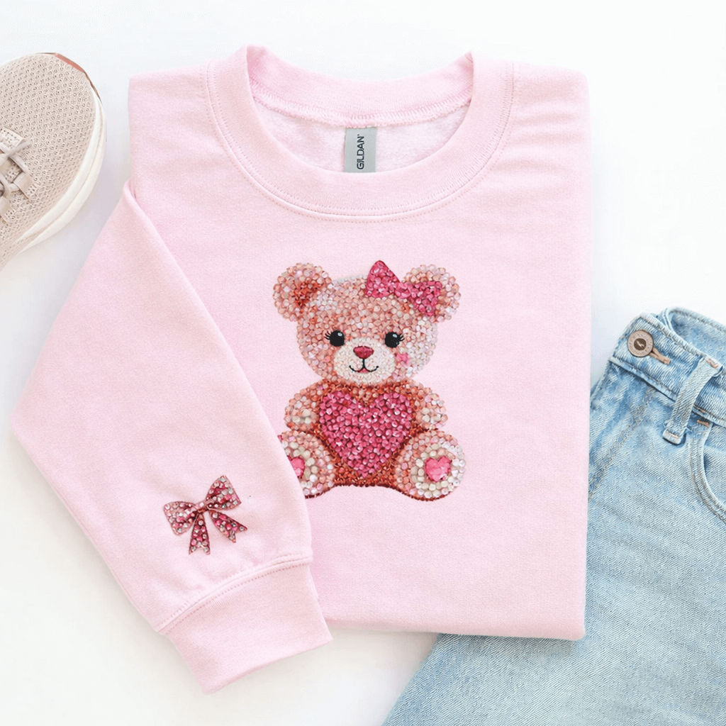 Diamond Teddy Bear Heart Toddler Sweatshirt with pink diamond teddy bear design and bow detail.
