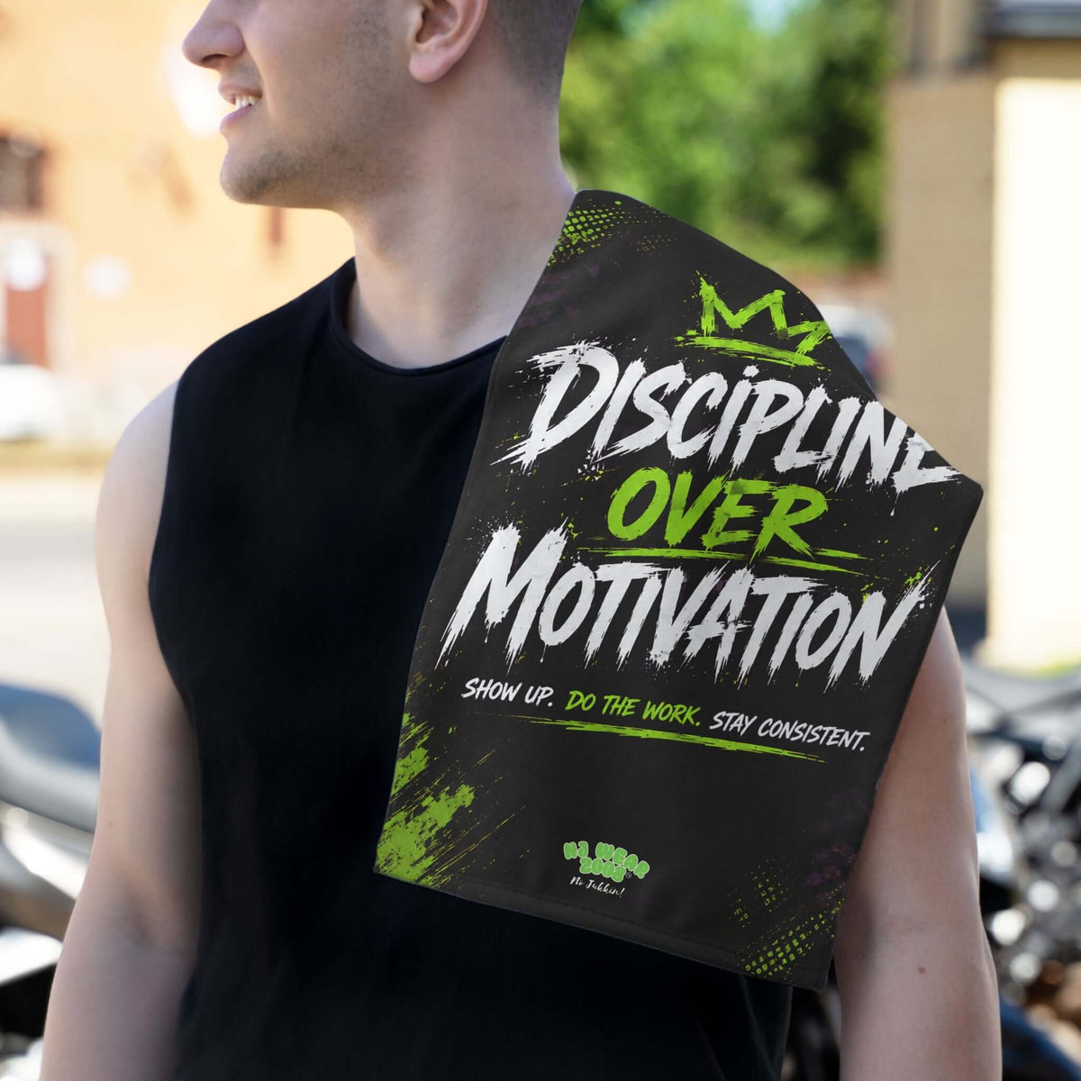 Athlete wearing a Discipline Gym Towel, showcasing motivational text for gym workouts.