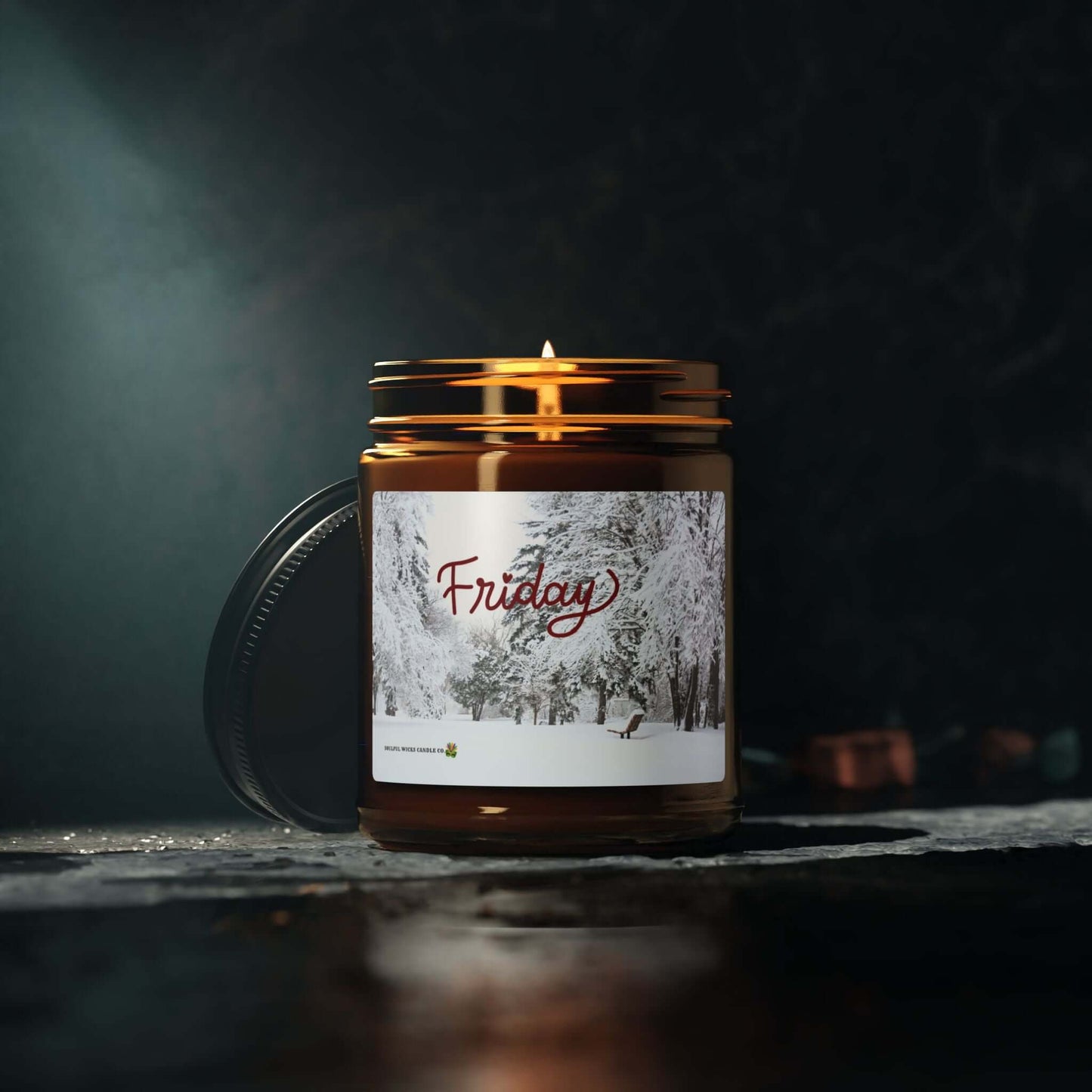 Friday Vibes Scented Soy Candle in amber glass jar, lit and showcasing warm ambiance with a snowy background.