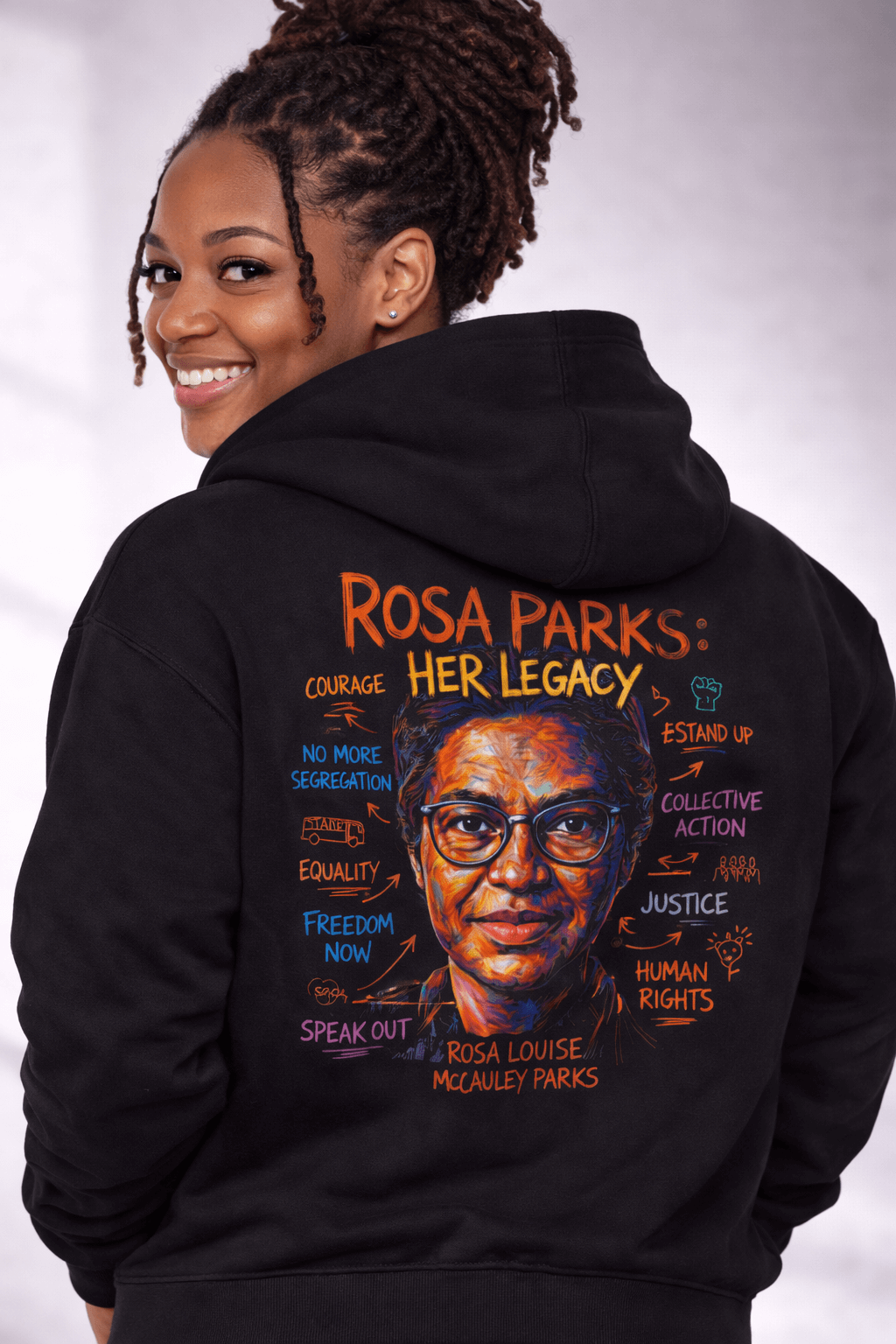 Model showcasing HER LEGACY hoodie featuring Rosa Parks illustration and powerful messages on the back.