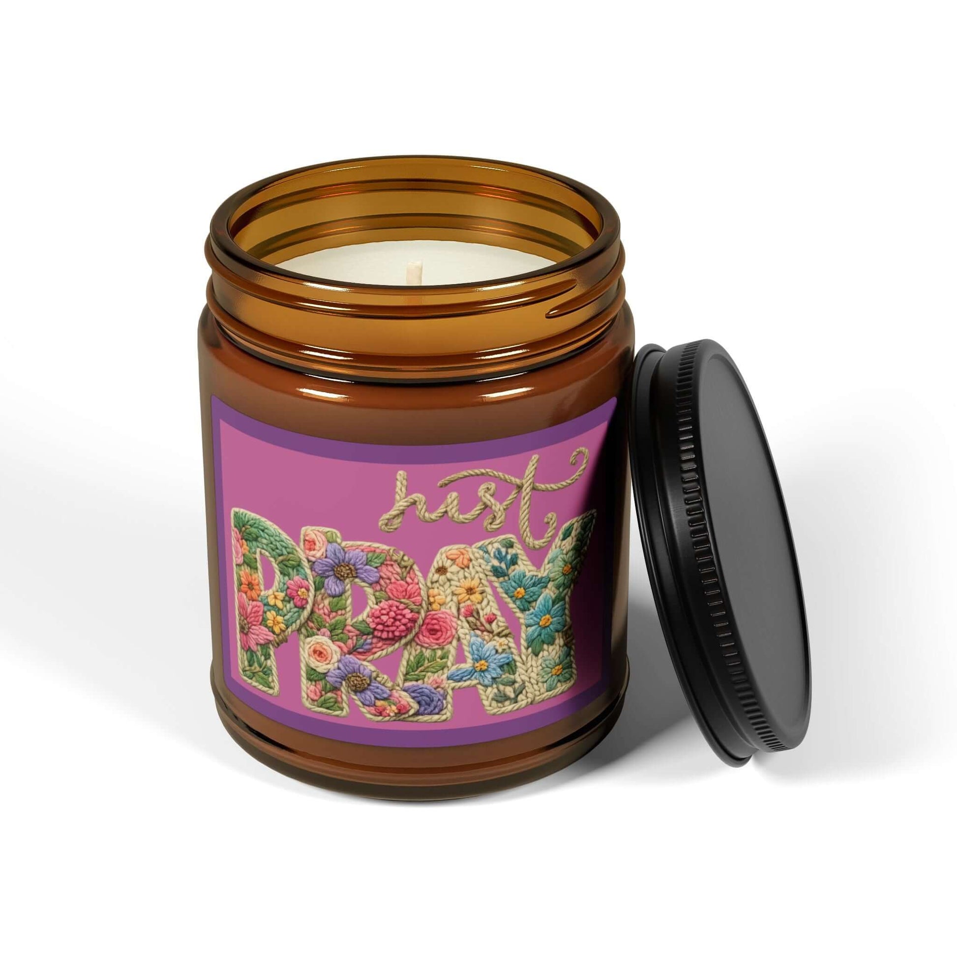 Just Pray Vegan Soy Candle in amber jar with floral design and black lid, perfect for creating a calm atmosphere.