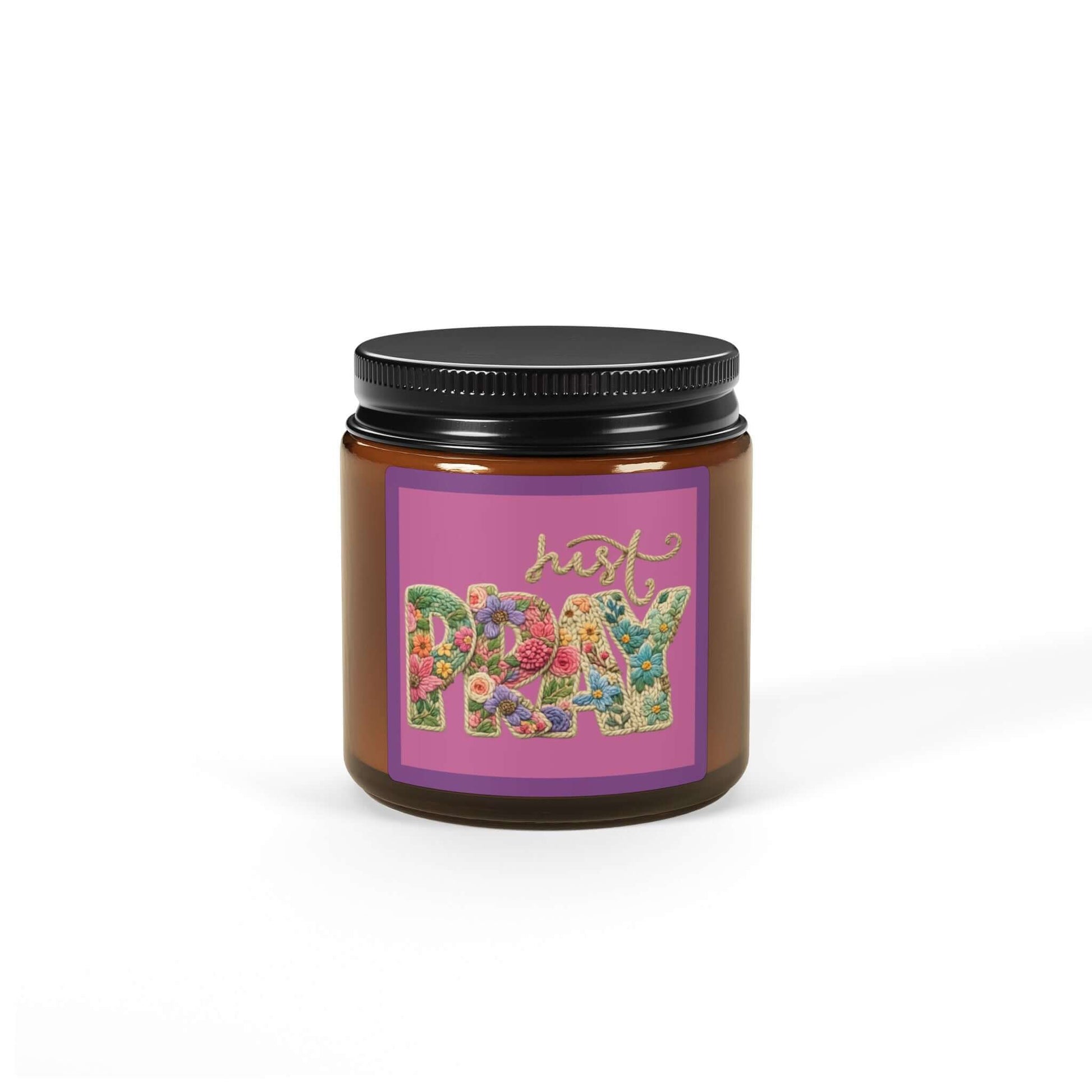 Just Pray Vegan Soy Candle in an amber jar with colorful floral label.