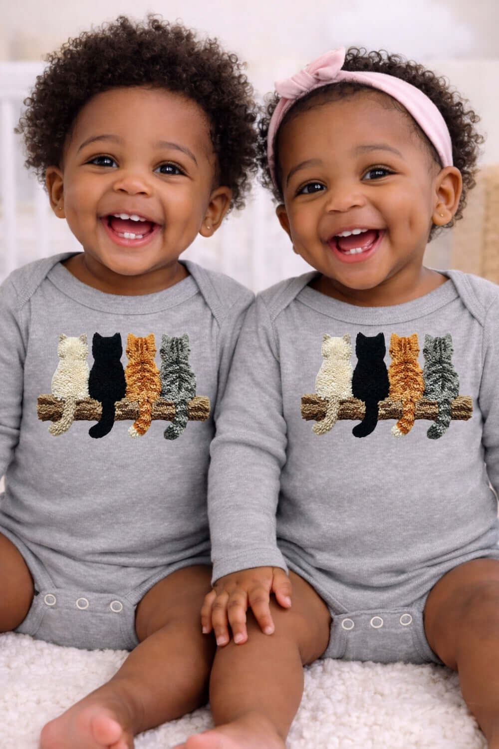 Lovely Kittens infant long sleeve bodysuit featuring two happy babies wearing matching Onesies with kitten motifs.