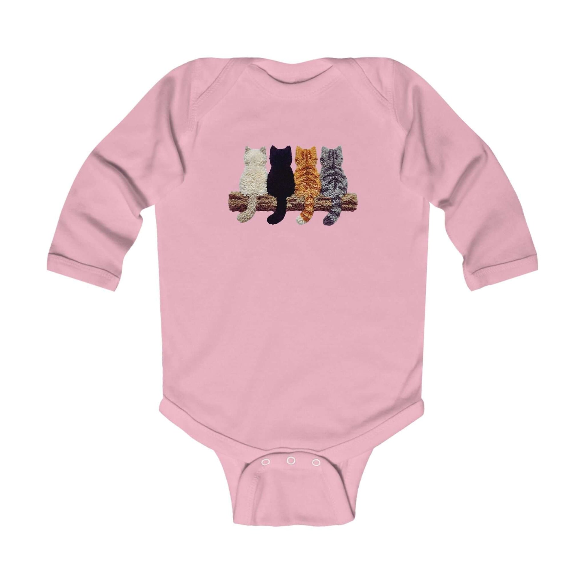 Lovely Kittens faux yarn long sleeve bodysuit with playful kitten motifs on a pink background.