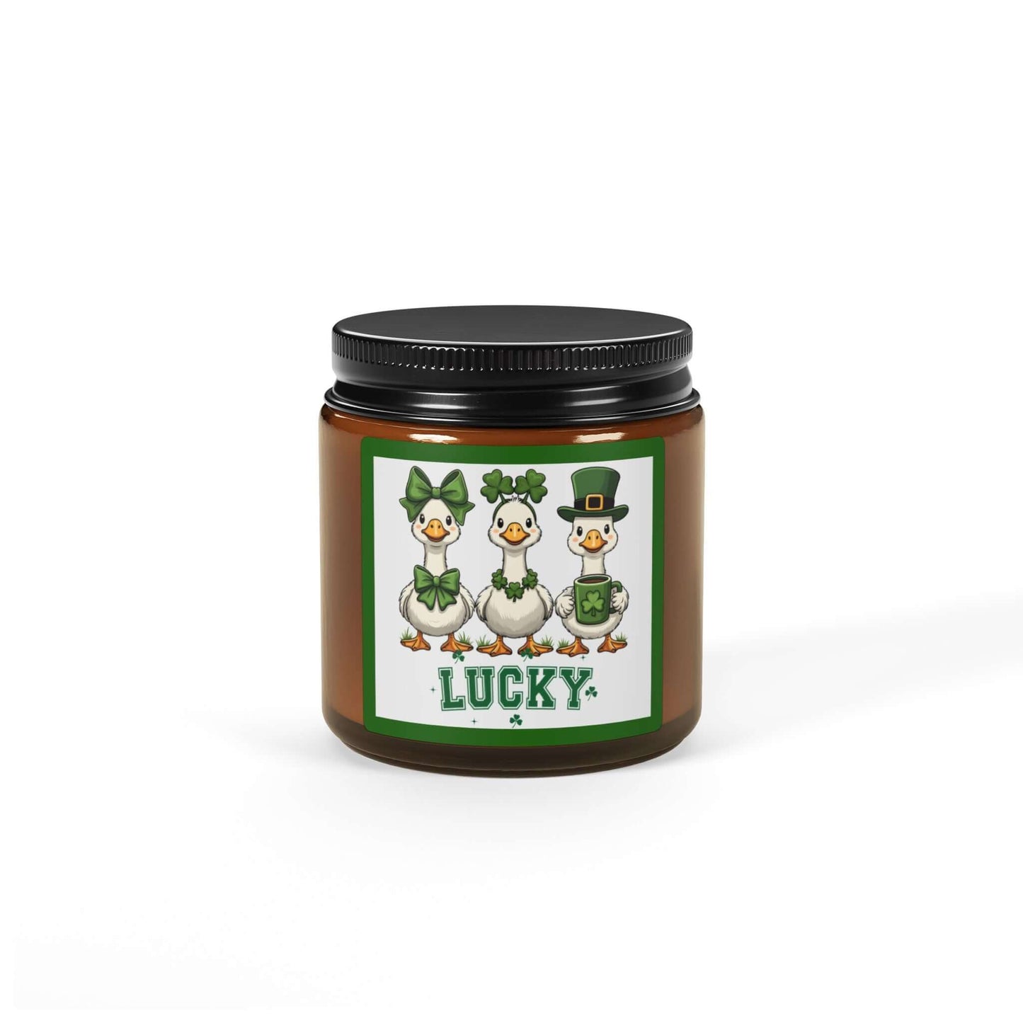 Lucky Ducks Vegan Soy Candle in amber jar with playful label featuring three ducks for St. Patrick’s Day.