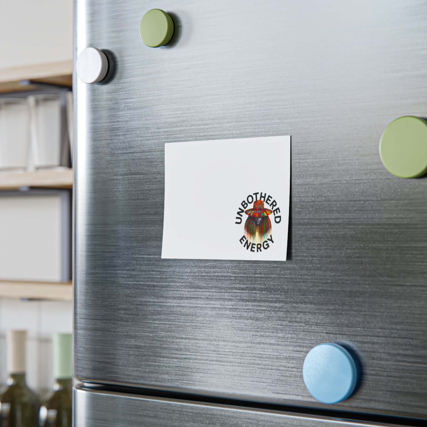 Unbothered Energy Post-it Note Pads displayed on a refrigerator, showcasing a vibrant design and reminder space.