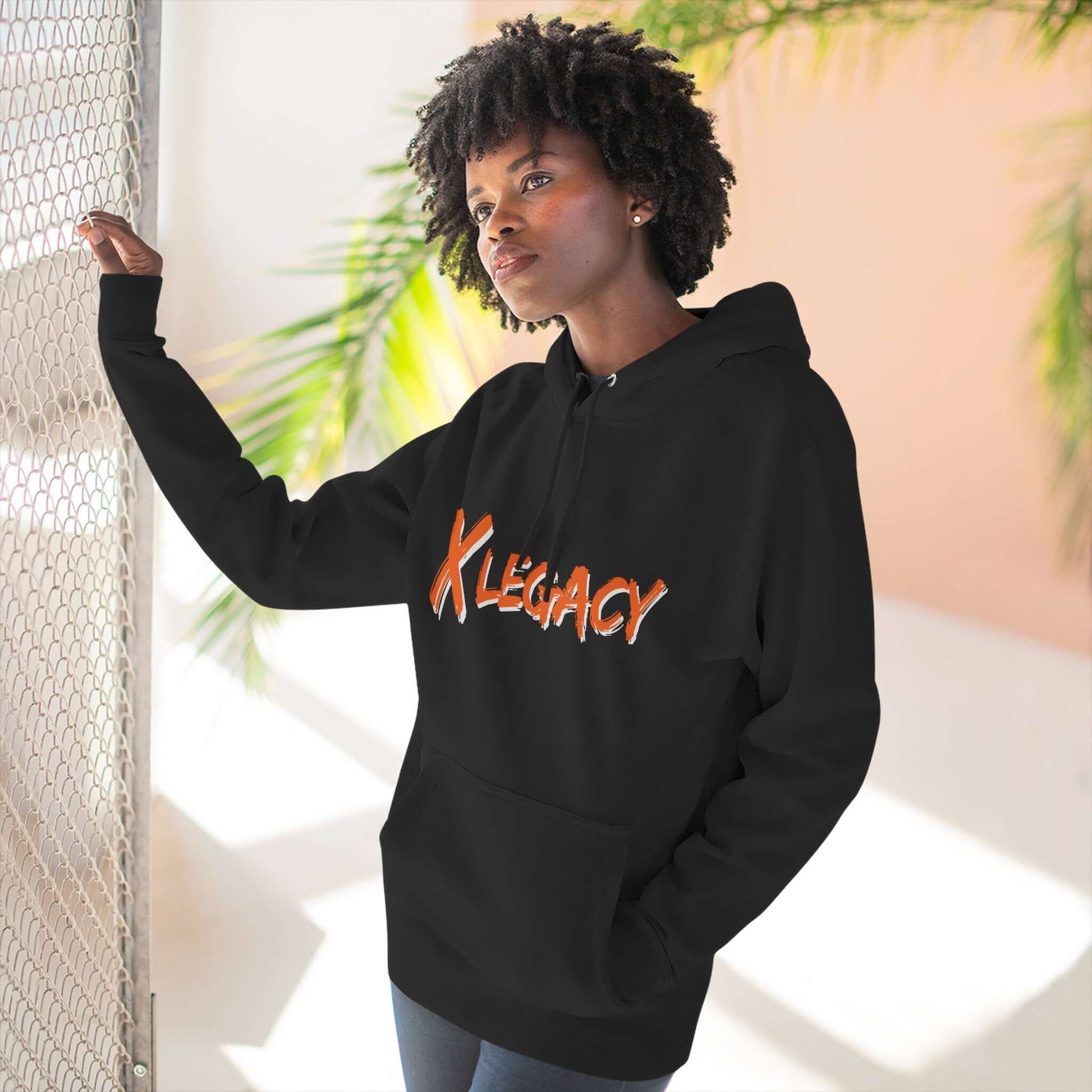 Model wearing the X LEGACY Hoodie in black, showcasing premium fleece material and stylish design.